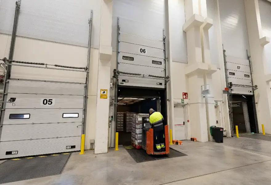 Warehouse loading docks with a forklift heading out