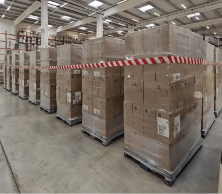 Reckitt pallets in a marked-off floor area in a Grupo Akoma warehouse