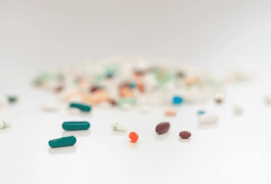 Tablets and capsules on a white background